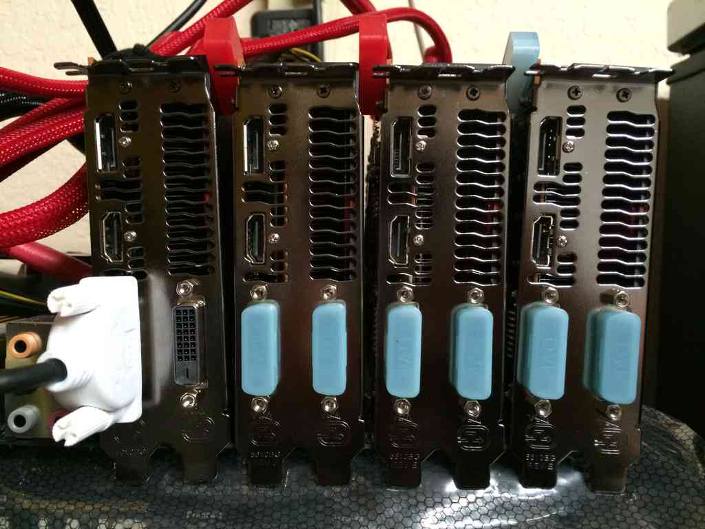 Back of the 4 R9 290s, each with a spacer between them to increase the airflow to the inner cards